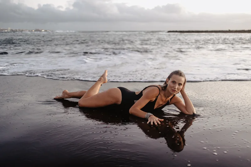 Joanna Moro portrait session with ocean waves in black and white aesthetic