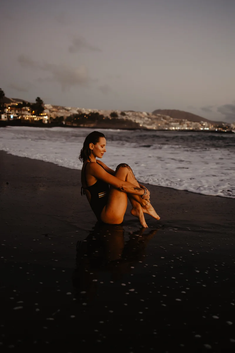 Joanna Moro portrait session on wet sand with water reflection effect