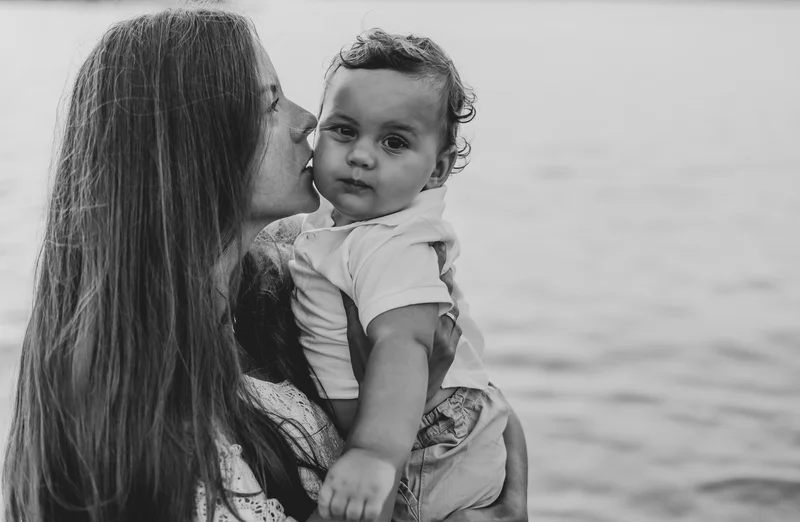 Intimate black and white portrait of mother with child in Tenerife