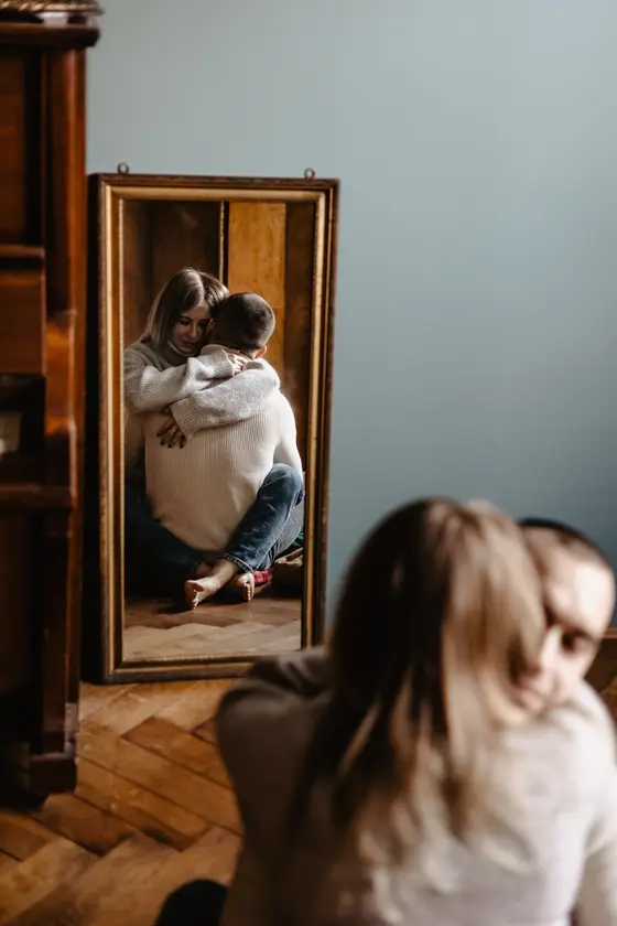 Couple in mirror reflection preparing for home photo session preparation Tenerife intimate