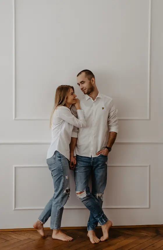 Couple in white outfits home photo session preparation Tenerife elegant styling preparation