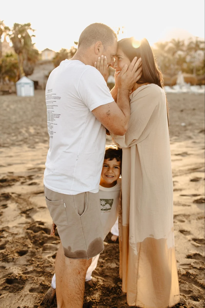 Family embracing in warm light during a family photo session