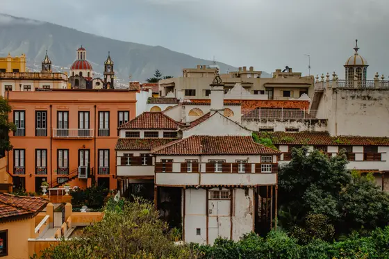 Panorama of historic La Orotava town with colorful rooftops and colonial Tenerife architecture against mountains