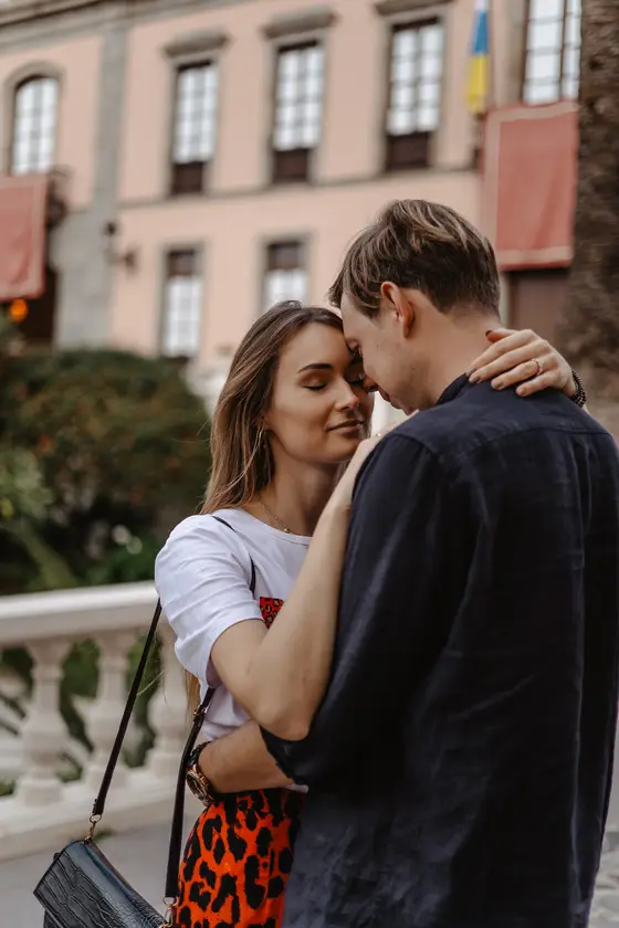 Intimate moment of couple during photoshoot in historic La Orotava center Tenerife with colonial buildings