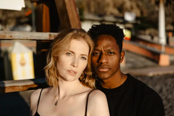 Romantic couple in intimate portrait against industrial Tenerife interior during professional photo session