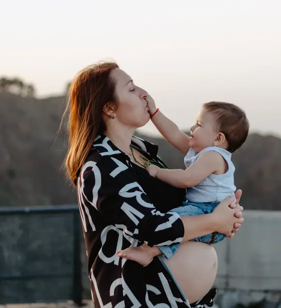 Raw mother and child portrait during golden hour before digital processing