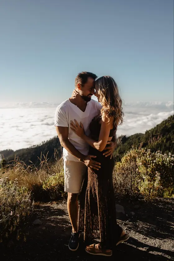 Tender portrait of a couple during a Teide session, closeness, emotion and rugged Tenerife landscape behind them