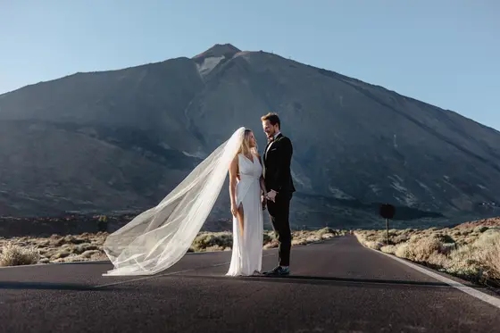 Tenerife wedding session couple against Mount Teide volcano with dramatically flowing veil