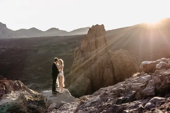 Newlywed couple Tenerife wedding session volcanic rock formations sunset golden light