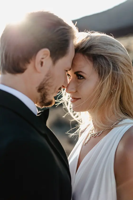 Intimate newlywed portrait Tenerife wedding session golden light volcanic landscape romantic moment